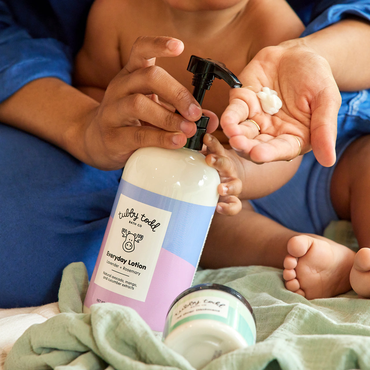 Mama pumping lotion into hand
